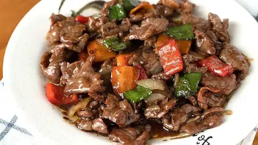 Ternera con champiñones